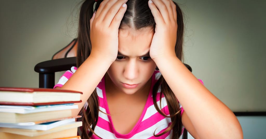 Frustrated Child with School Books