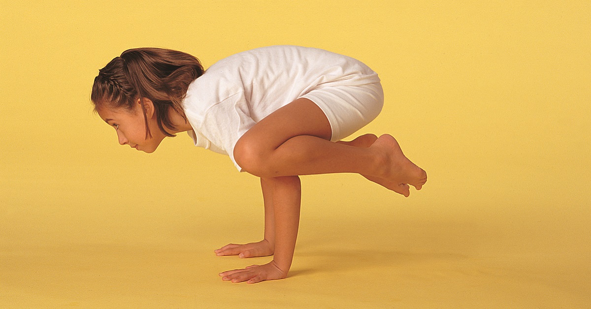 child in crow pose