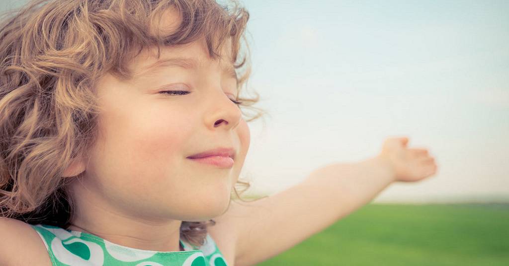 Happy Child in Spring Field