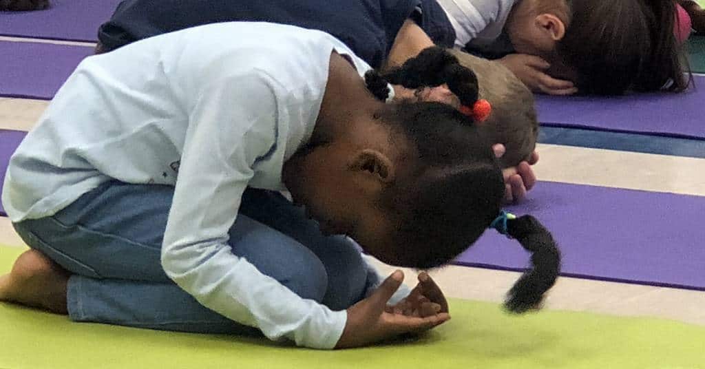 Girl in Child's Pose