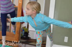 girl in flamingo pose