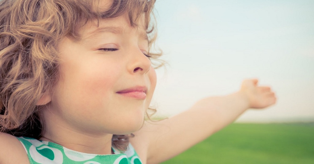 child with eyes closed